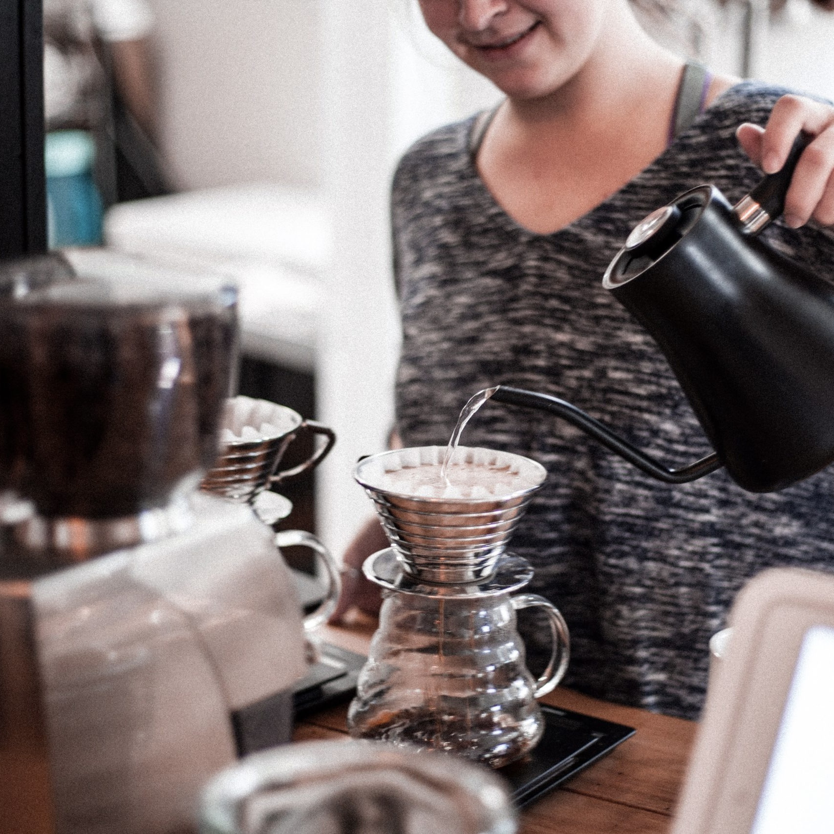 Barista preparing a pour-over coffee